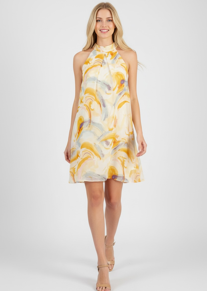 Woman wearing a yellow and white patterned dress on a white background