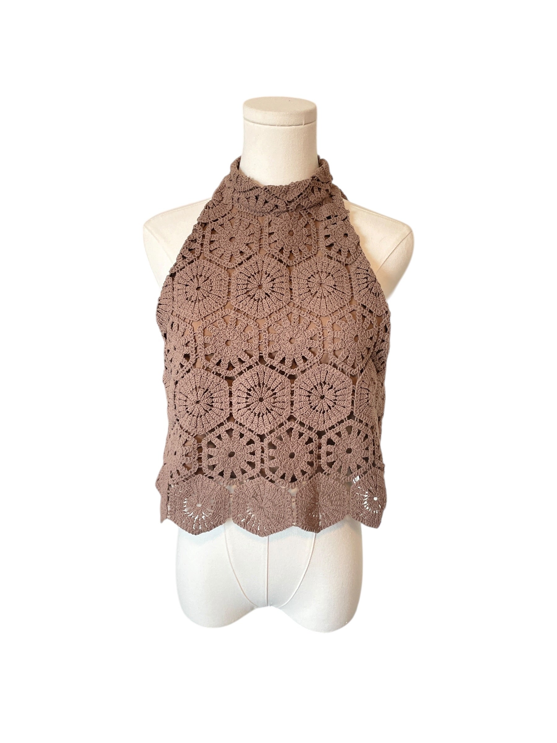 Brown crochet halter top on a mannequin against a white background