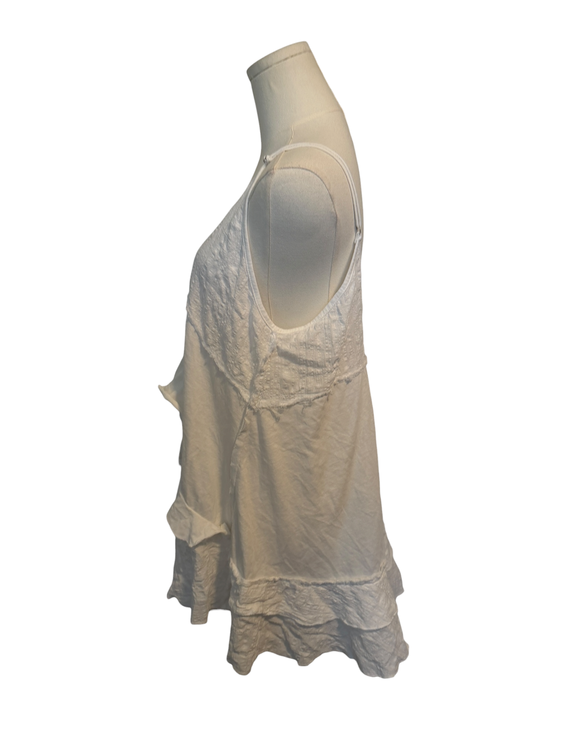 Beige sleeveless top on a mannequin against a white background