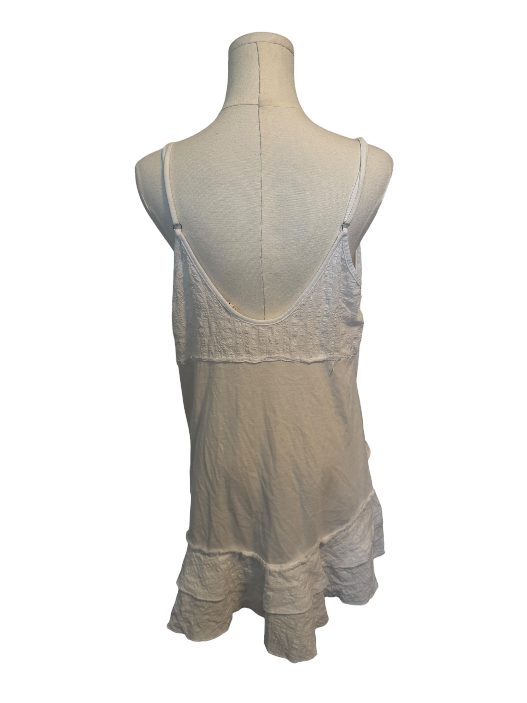 Mannequin wearing a beige lace nightgown on a white background