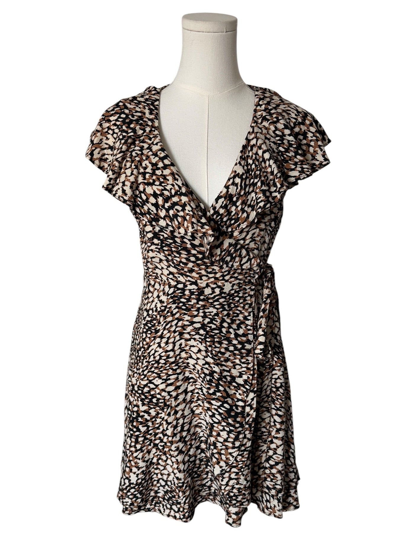 Leopard print dress on a mannequin against a white background