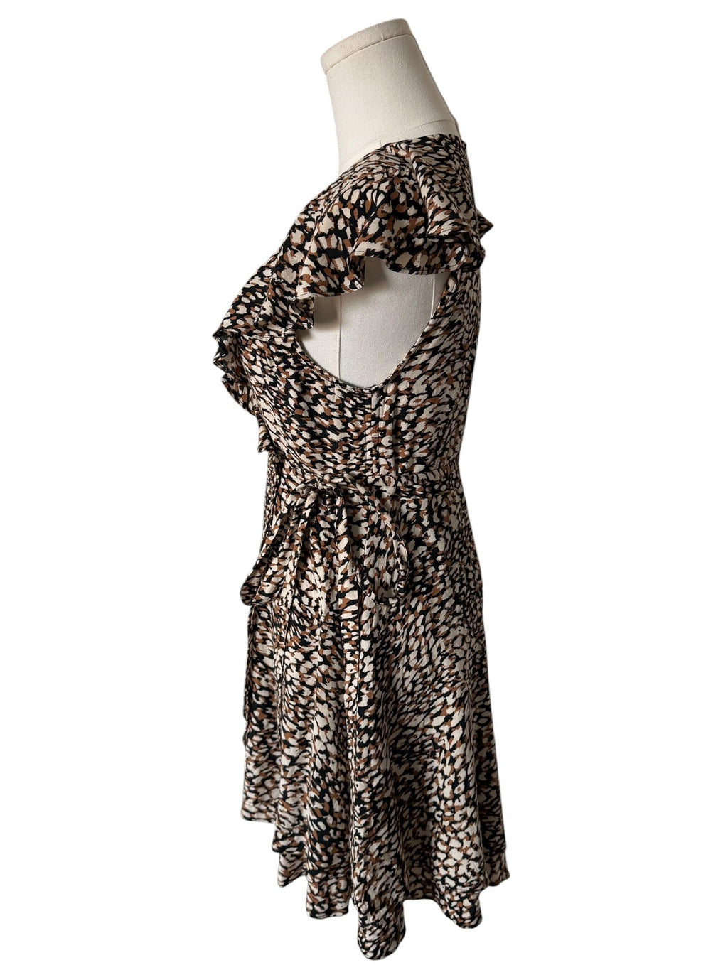 Leopard print dress on a mannequin against a white background