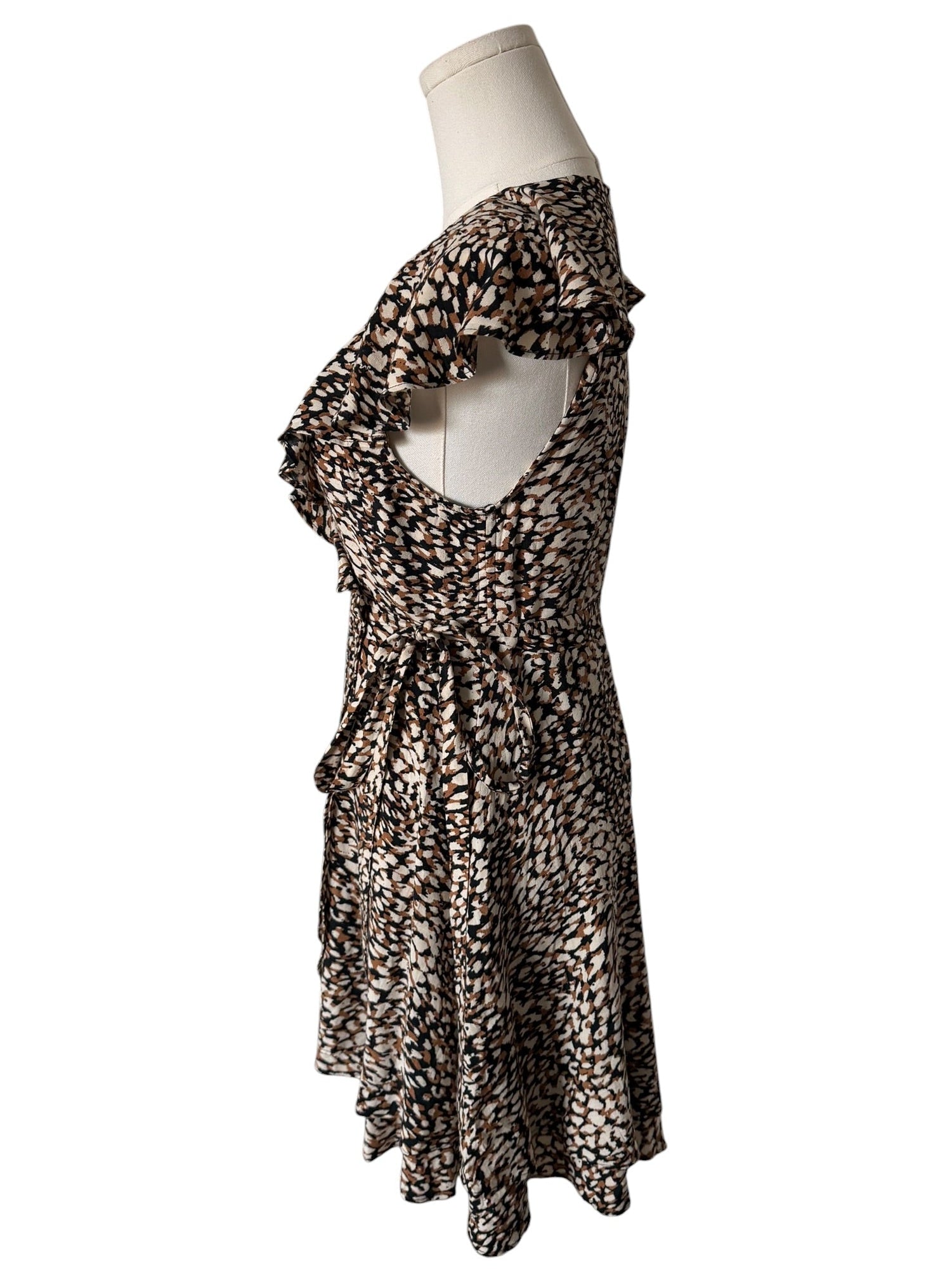 Leopard print dress on a mannequin against a white background