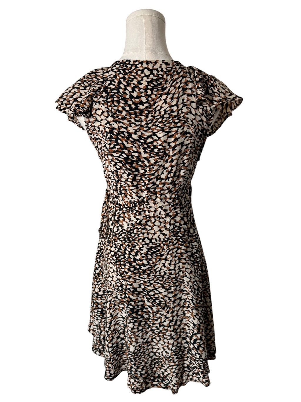 Leopard print dress on a mannequin against a white background