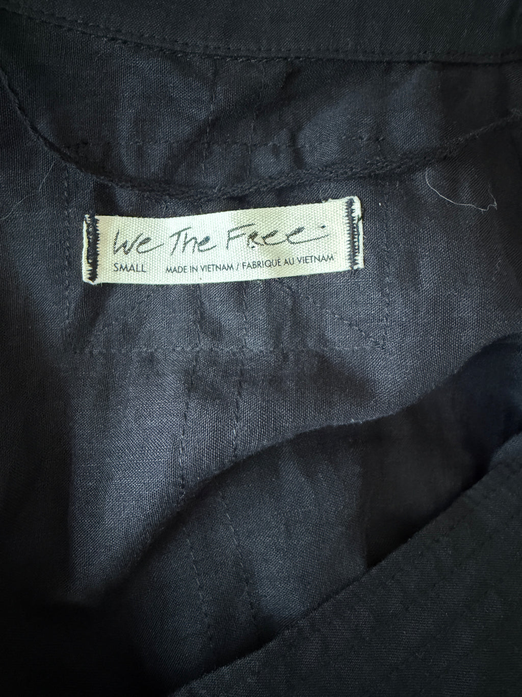 Close-up of a label on a dark fabric background