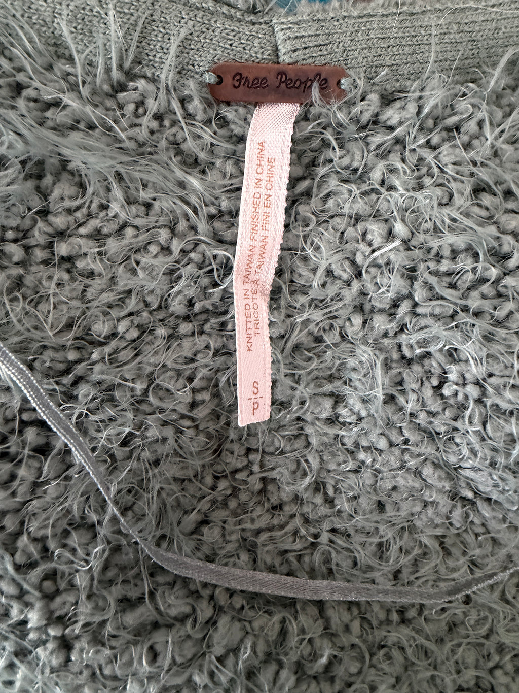 Textile with a label on a textured fabric background