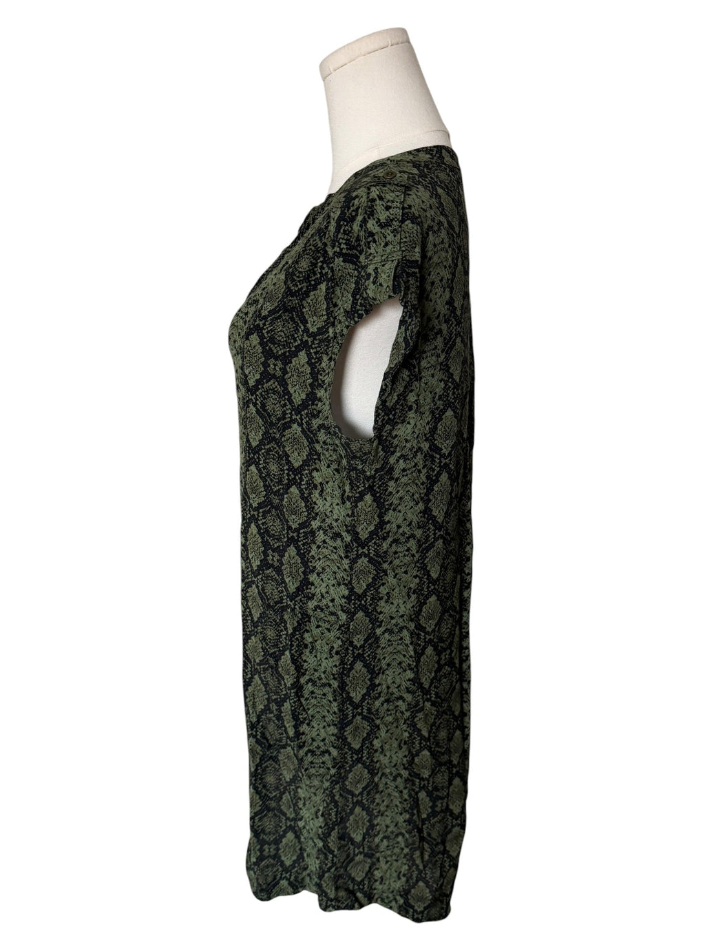 Green snake print dress on a mannequin against a white background