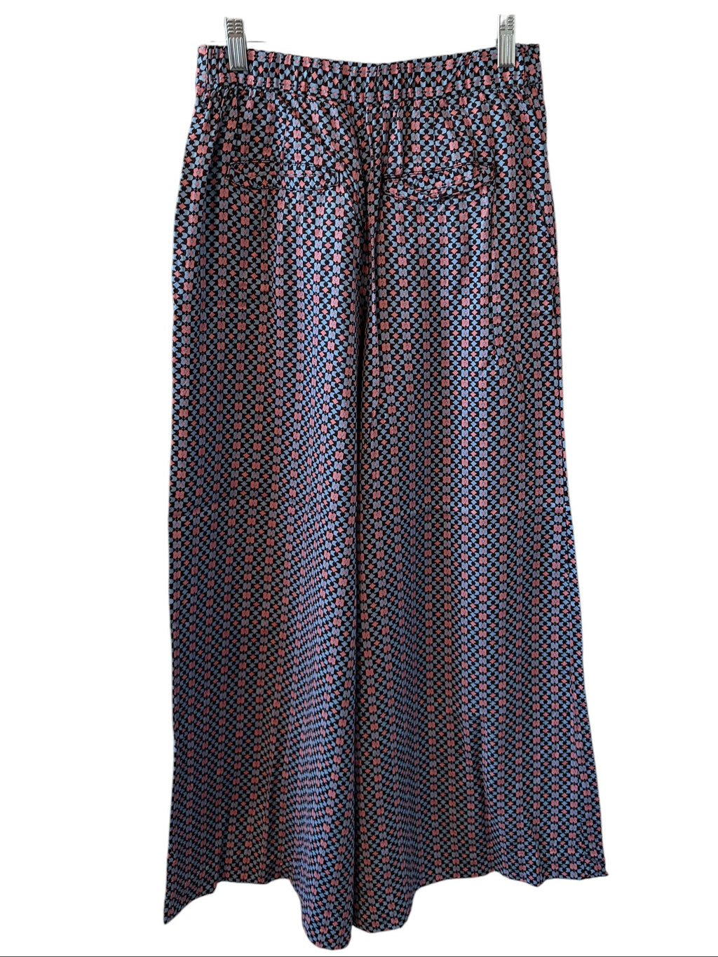 Patterned Pants on a hanger against a white background