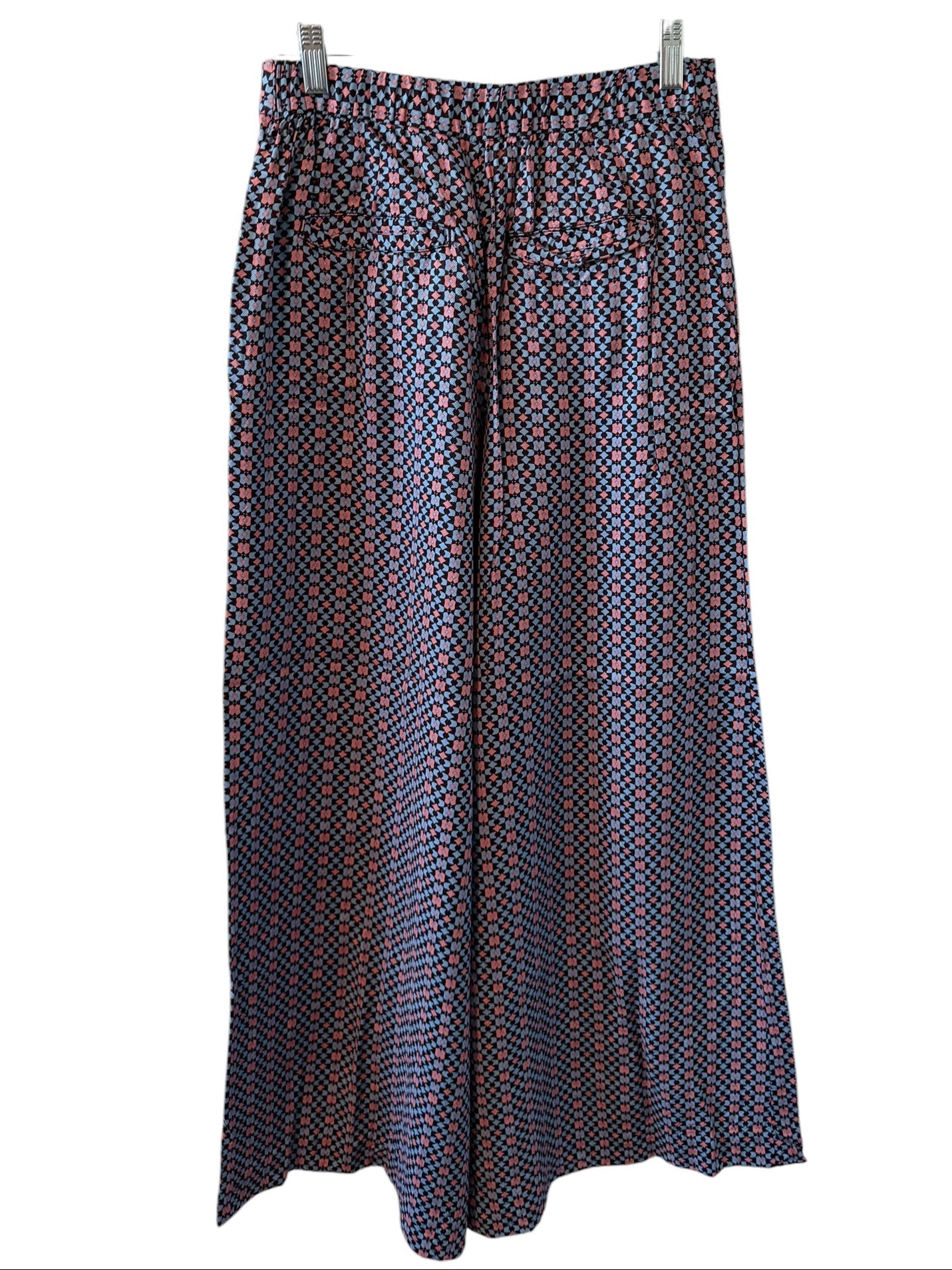 Patterned Pants on a hanger against a white background