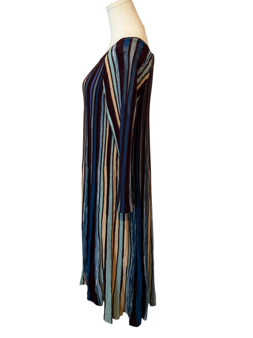 Striped dress on a mannequin against a white background