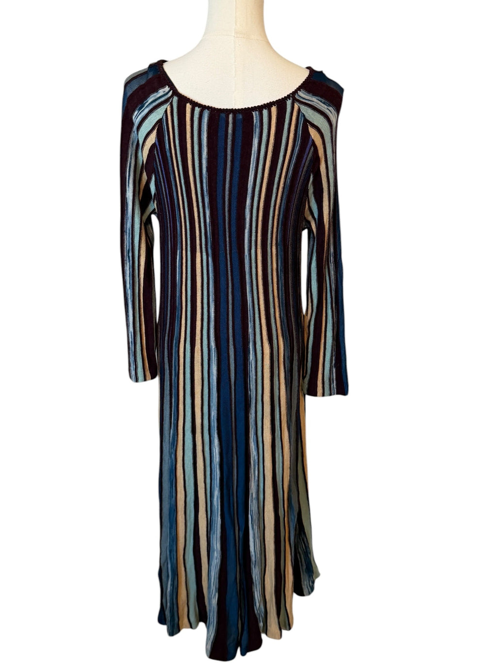 Striped dress on a mannequin against a white background