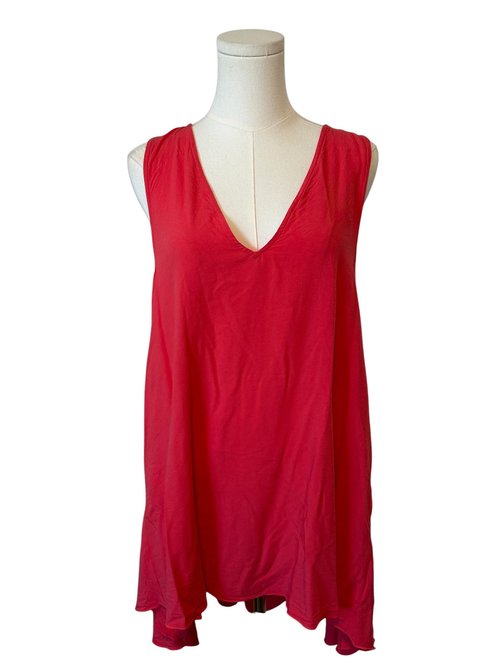 Red sleeveless dress on a mannequin against a white background