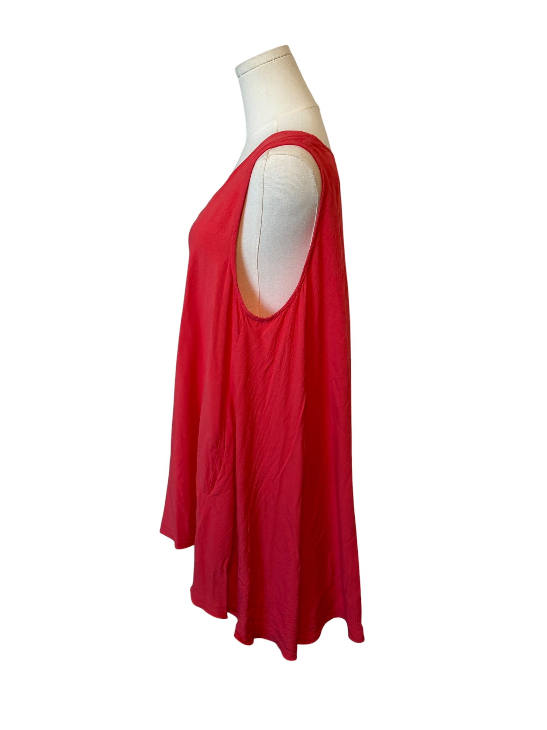Red dress on a mannequin against a white background