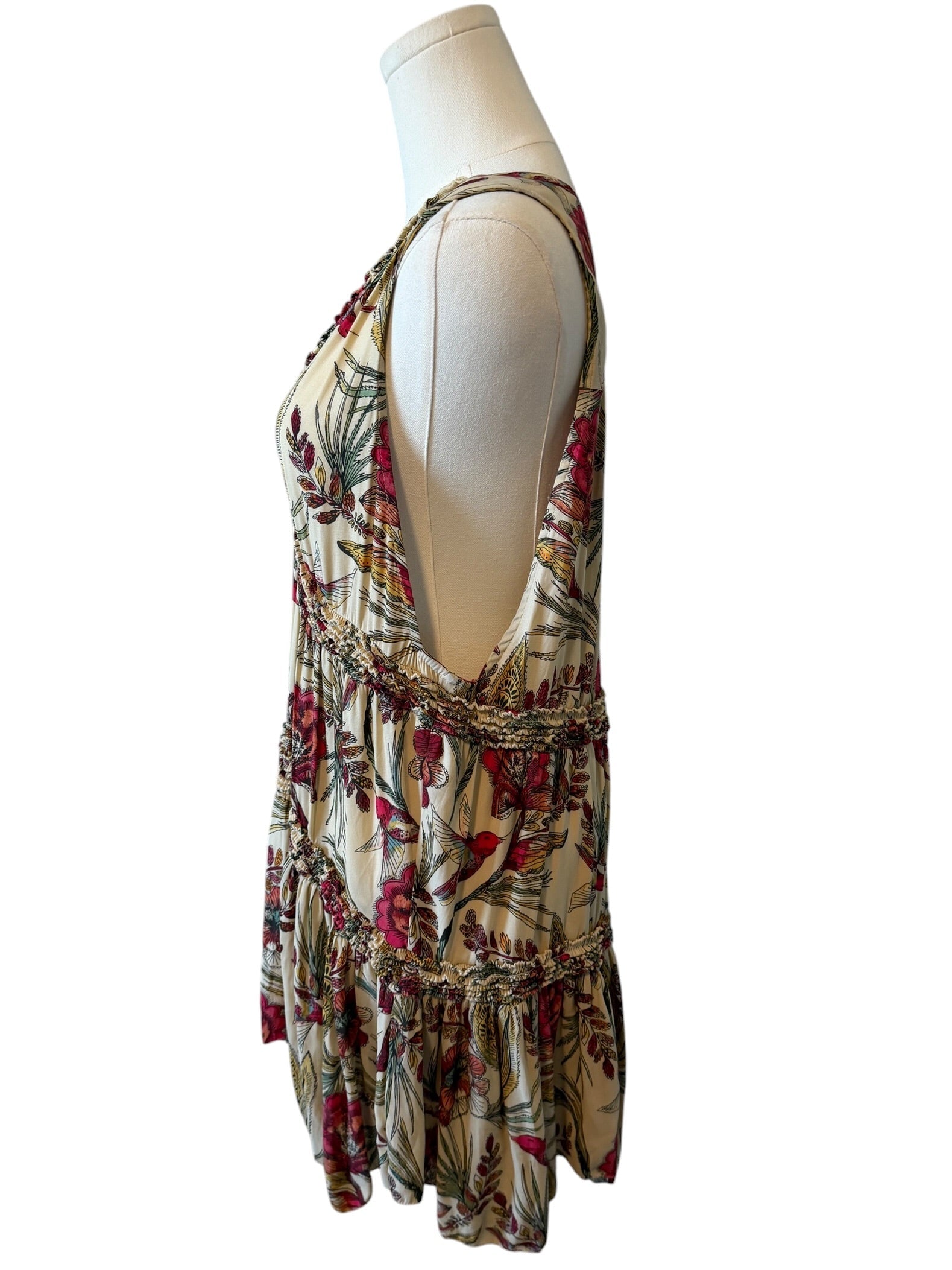 Floral dress on a mannequin against a white background
