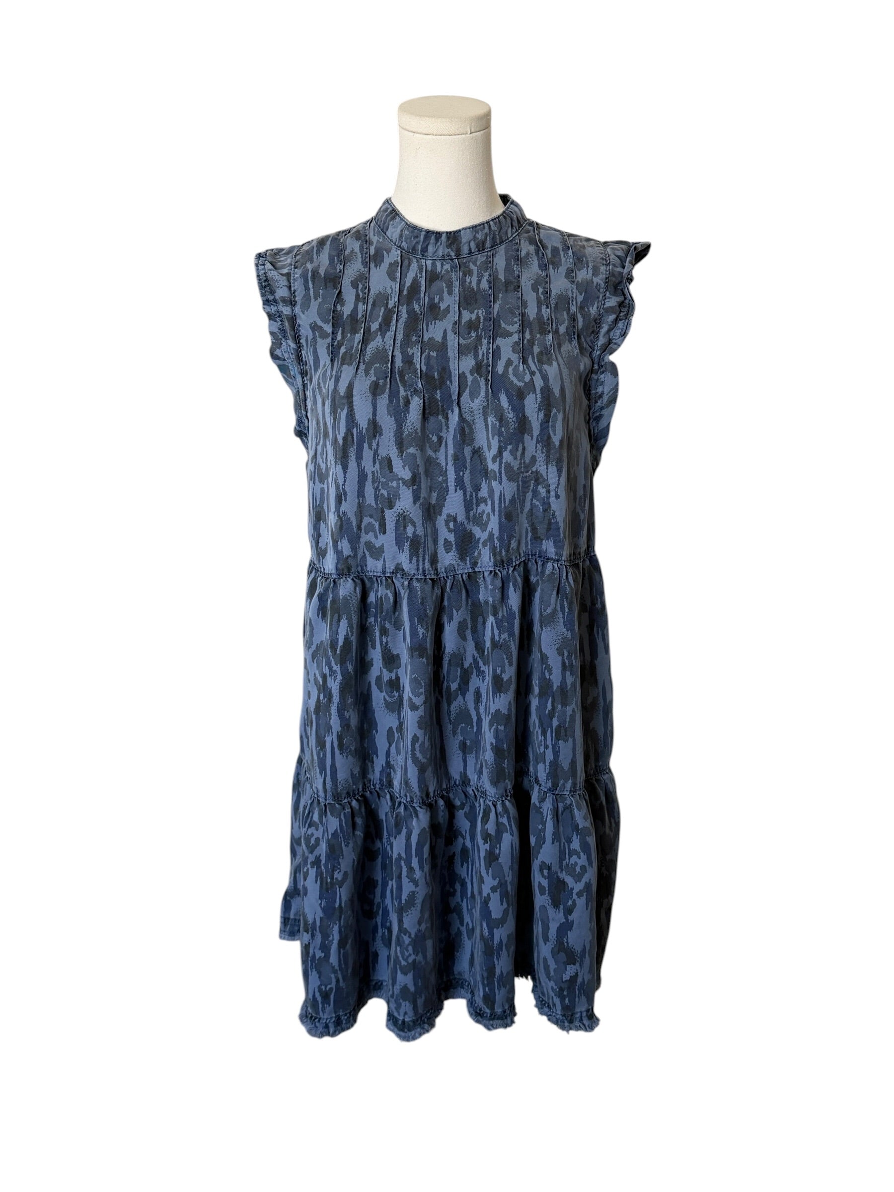 Blue patterned dress on a mannequin against a white background