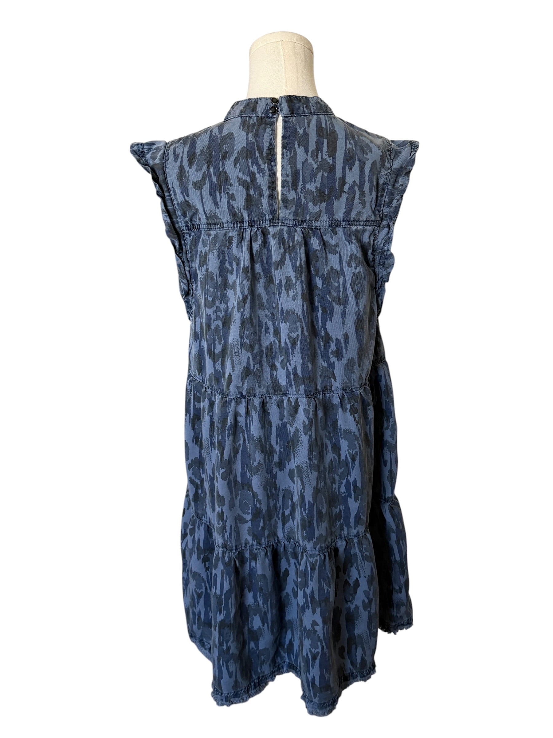 Blue patterned dress on a mannequin against a white background