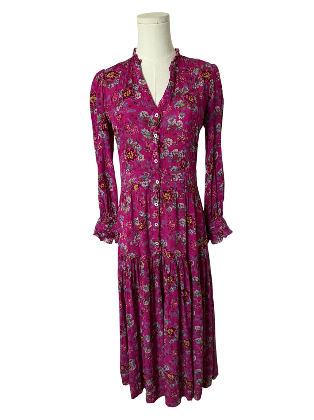 Purple floral dress on a mannequin against a white background