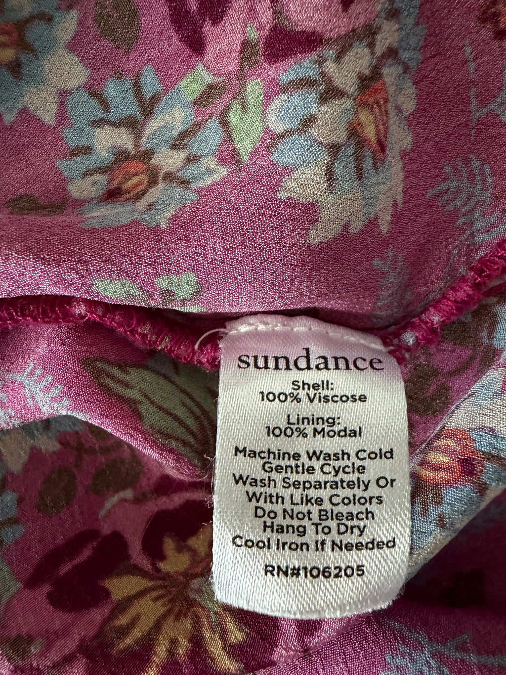 Fabric with a label on a floral-patterned background