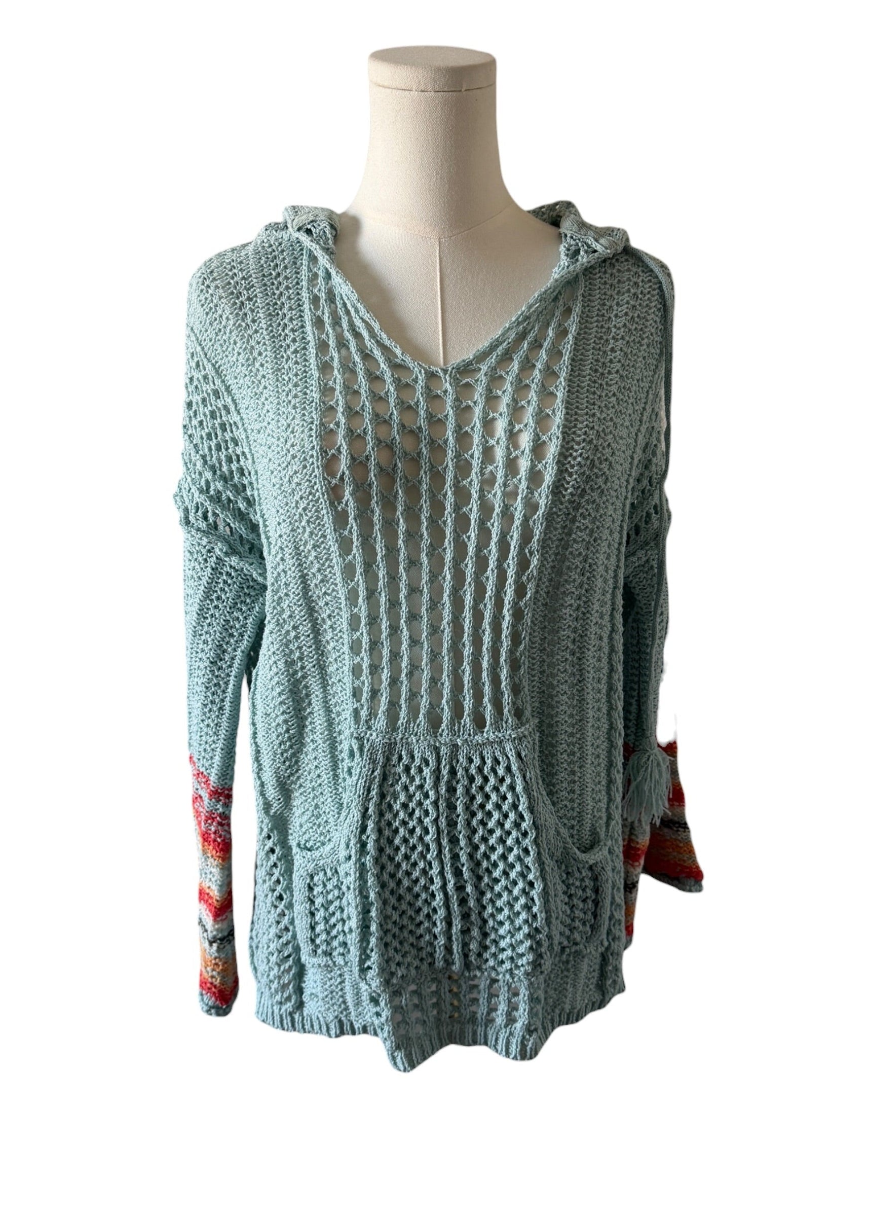 Knitted sweater on a mannequin against a white background