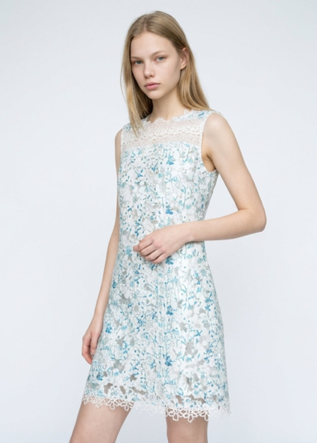 Woman wearing a floral dress on a white background