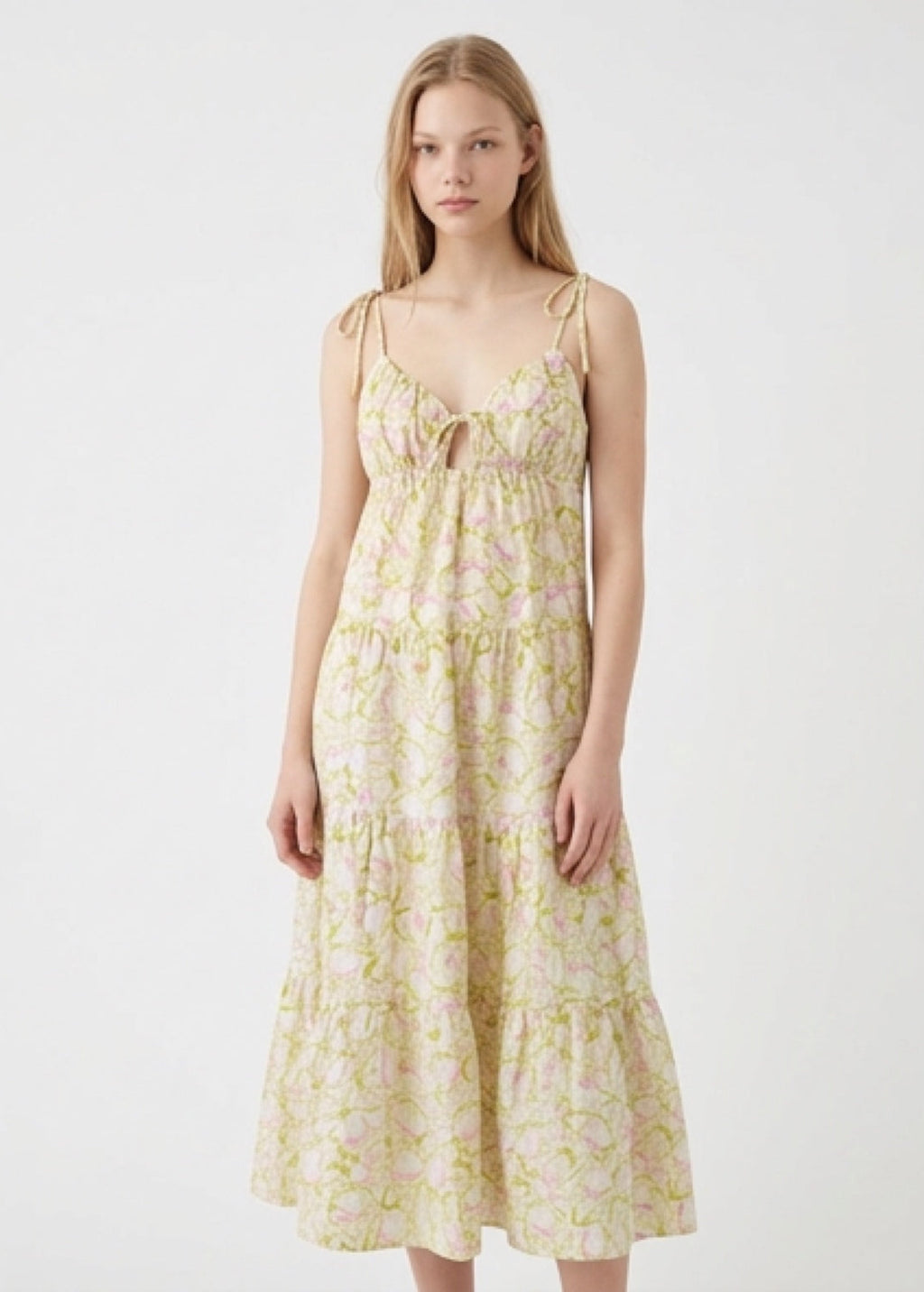 Woman wearing a floral dress on a white background