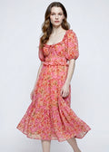 Woman wearing a floral dress on a white background