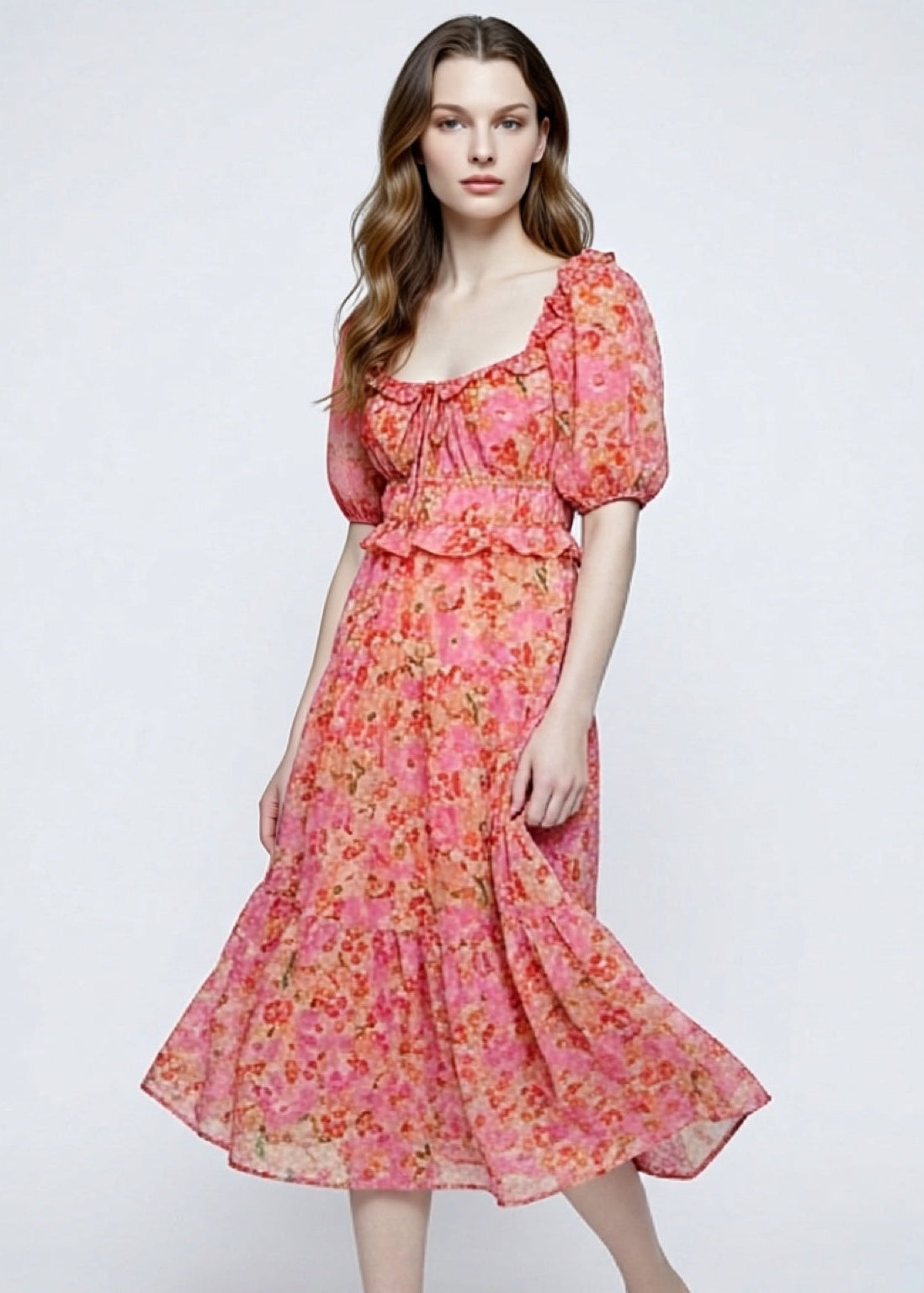 Woman wearing a floral dress on a white background
