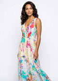 Woman wearing a colorful floral dress on a white background