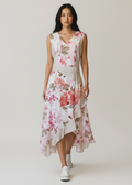 Woman wearing a floral dress on a plain background