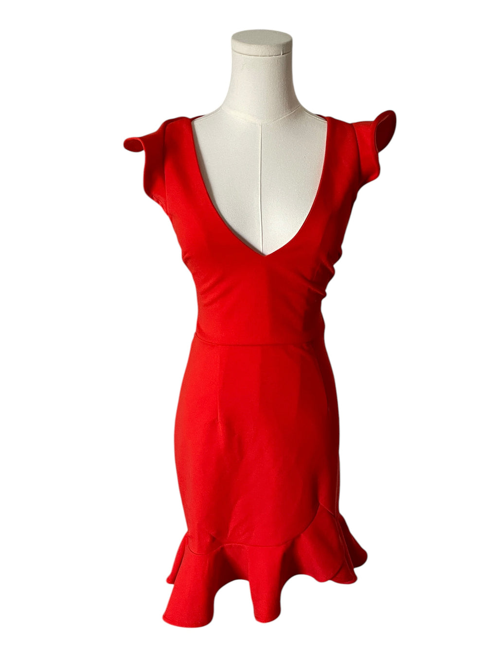 Red dress on a mannequin against a white background