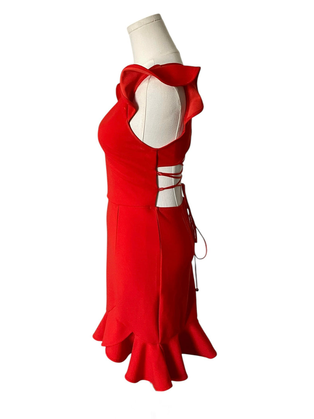 Red dress on a mannequin against a white background