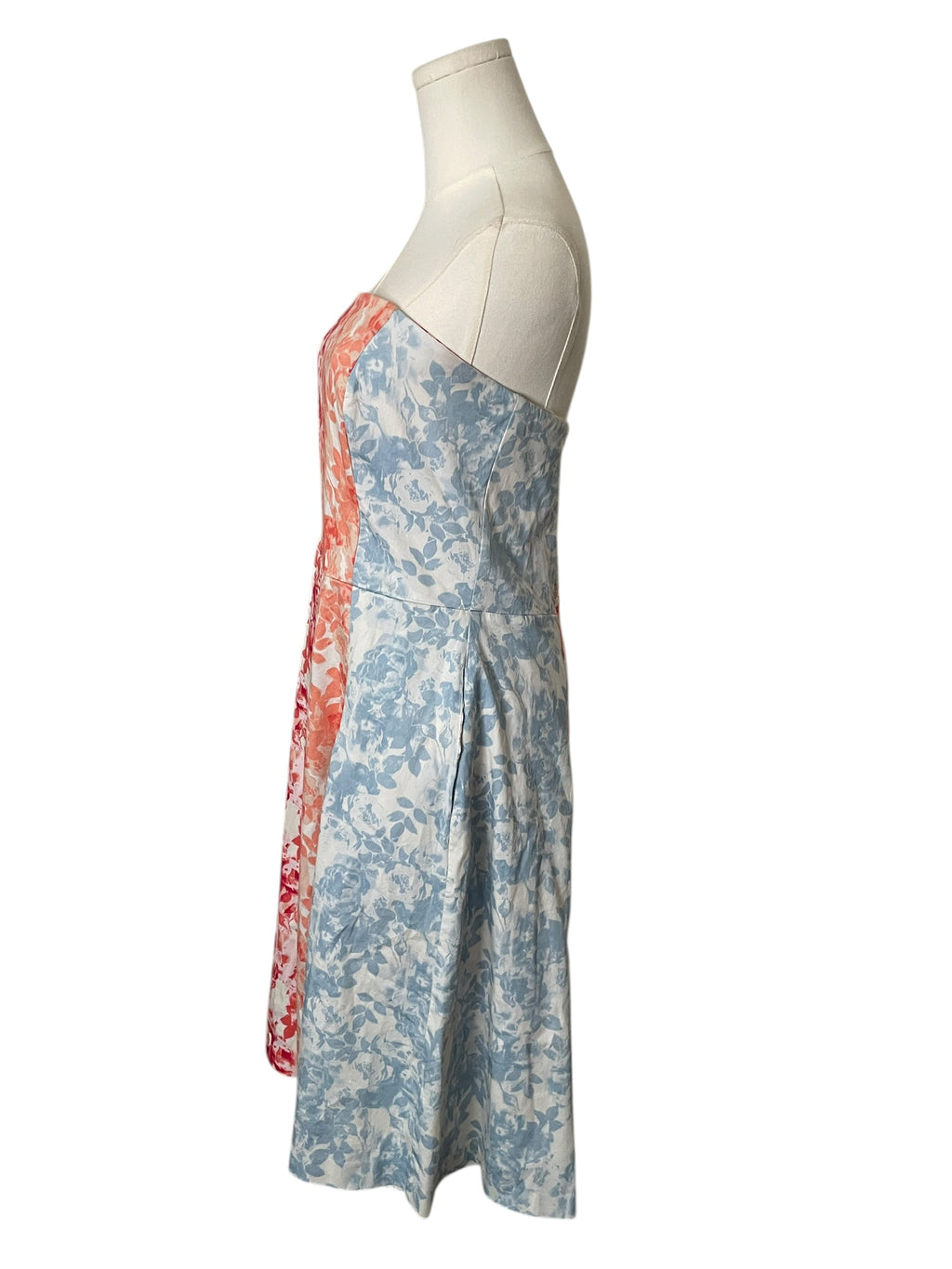 Floral dress on a mannequin against a white background
