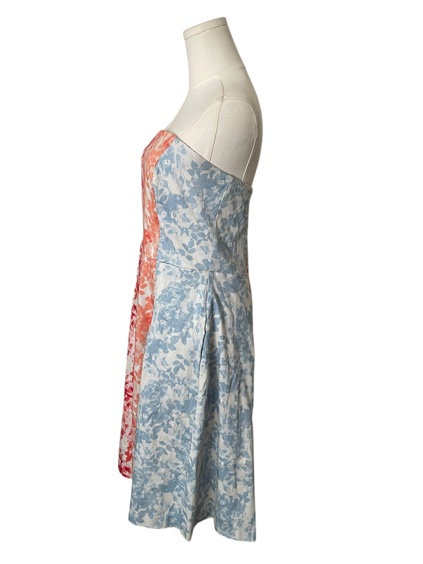 Floral dress on a mannequin against a white background