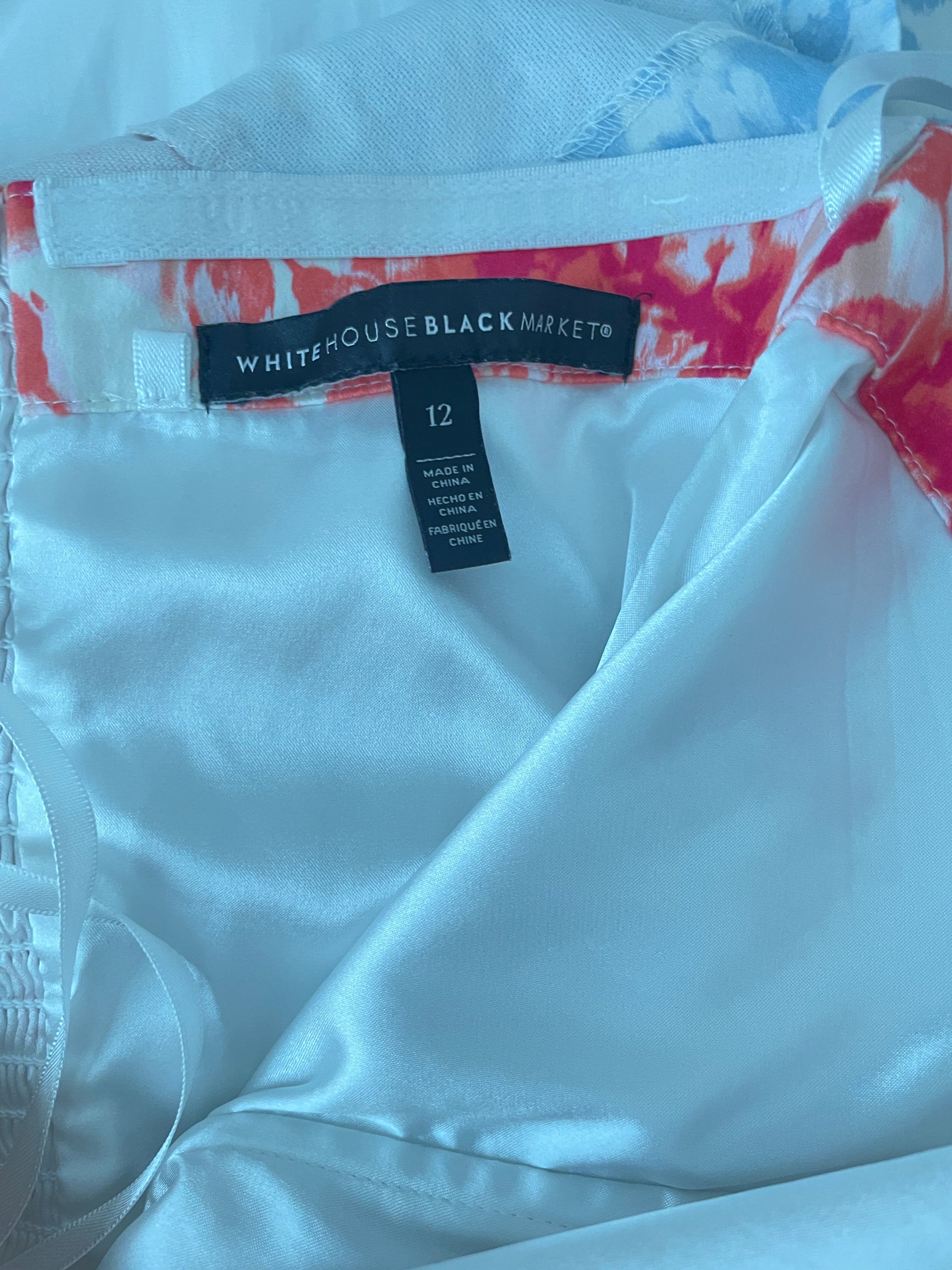 White garment with a brand tag on a white background