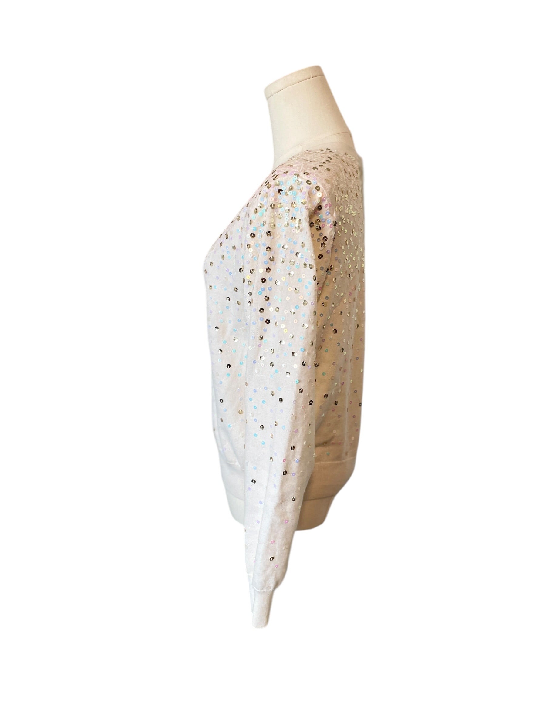 Mannequin wearing a beige and white patterned dress on a white background