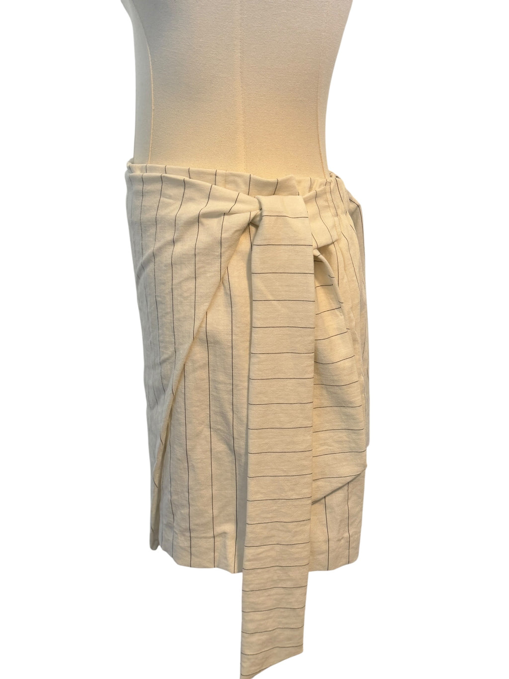 Beige skirt on a mannequin against a white background