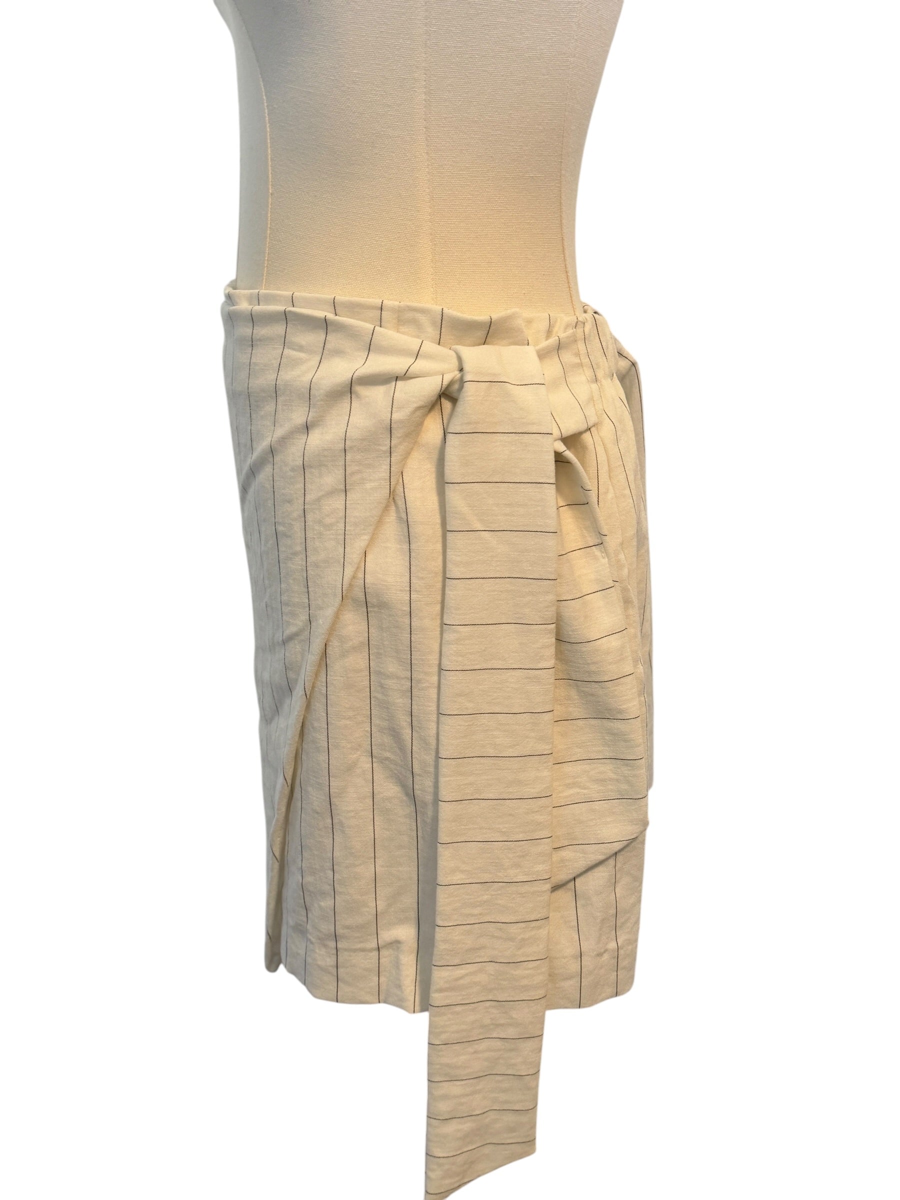 Beige skirt on a mannequin against a white background