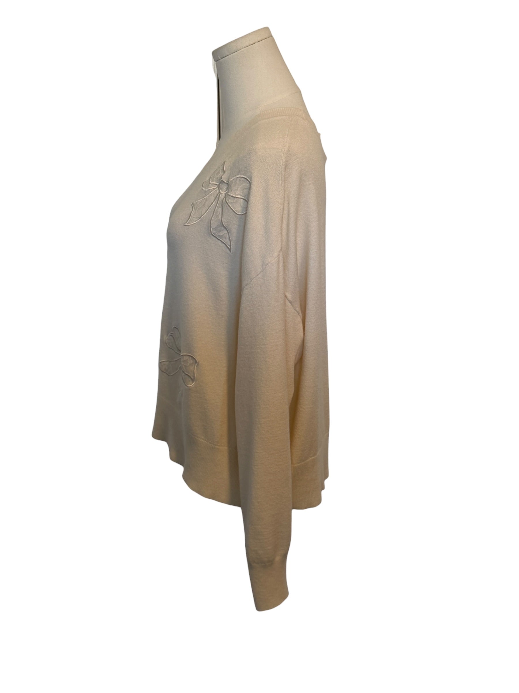 Beige sweatshirt on a mannequin against a white background
