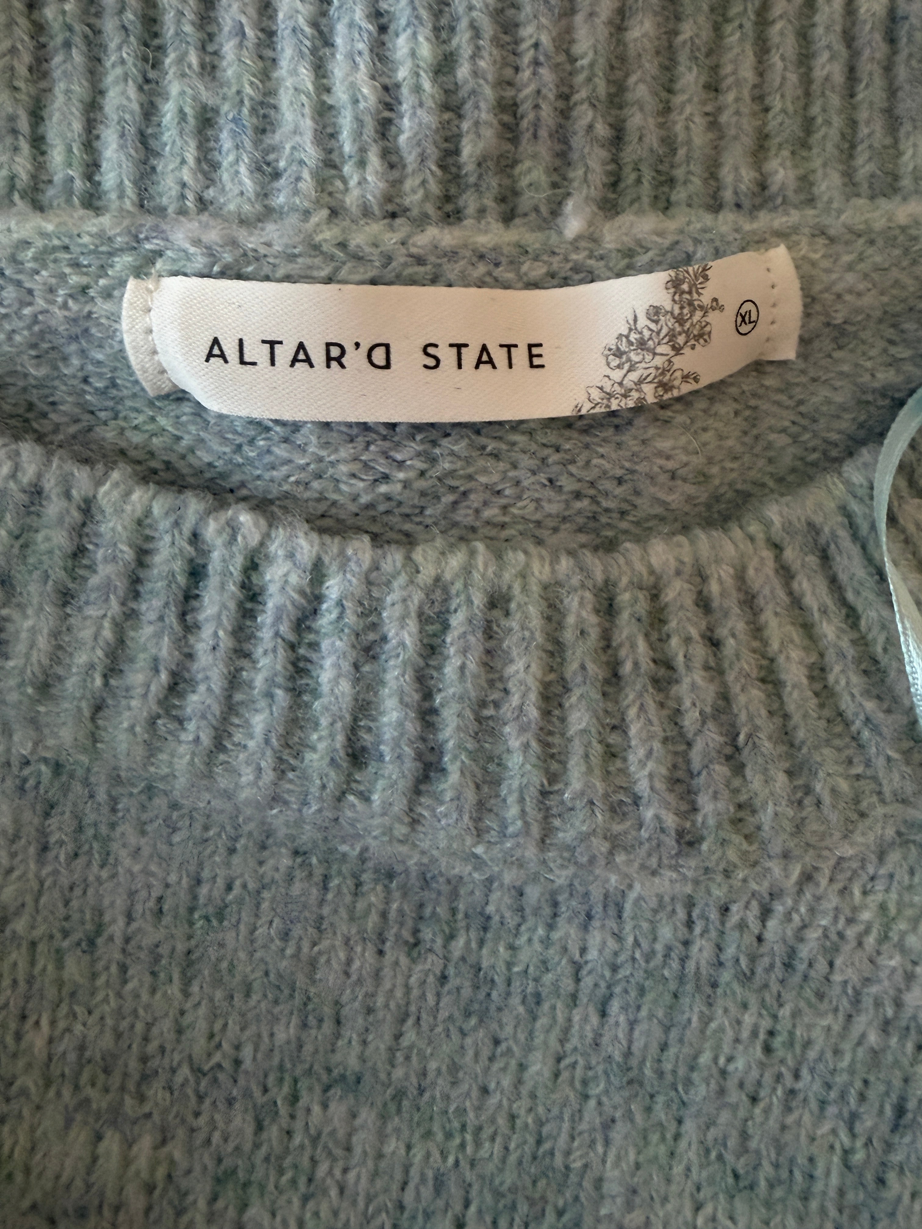 Gray textured fabric with a 'State' label on a plain background