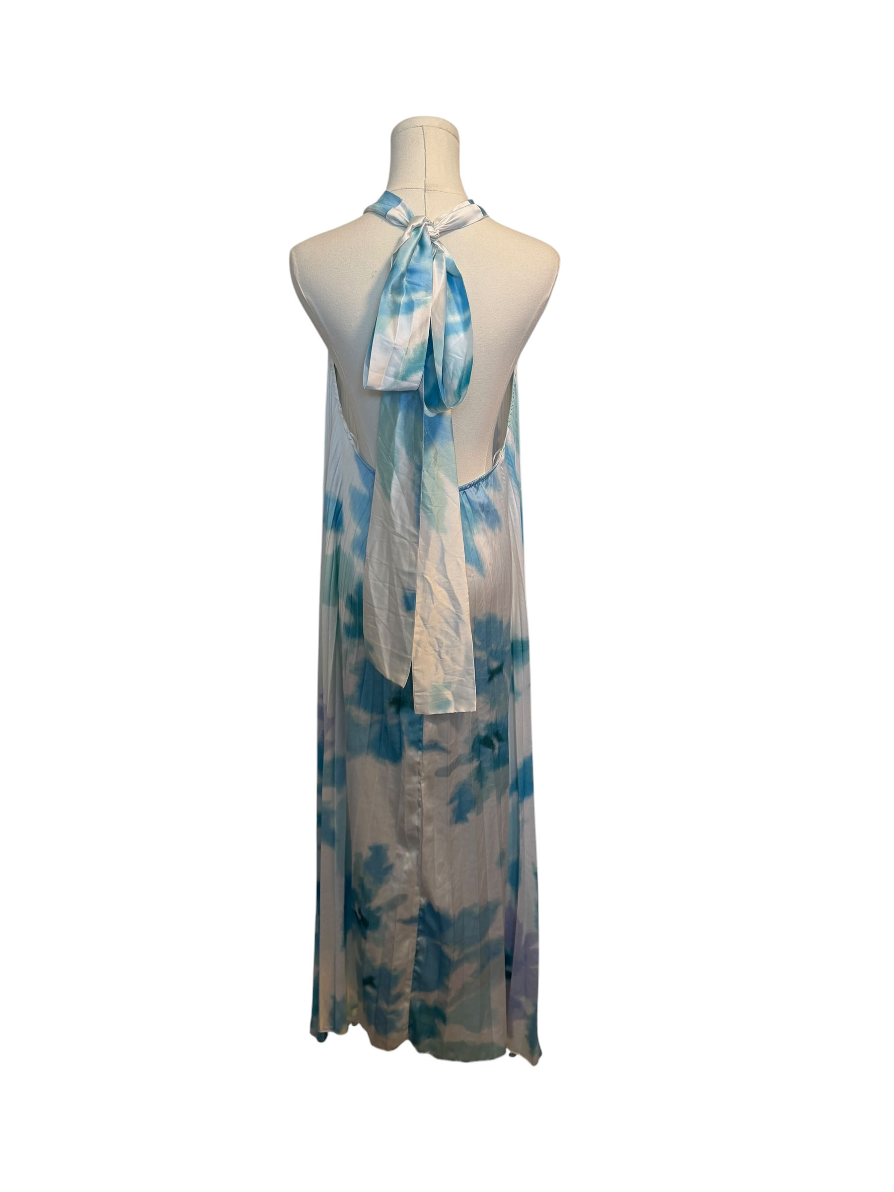 Mannequin wearing a blue and white patterned dress on a white background