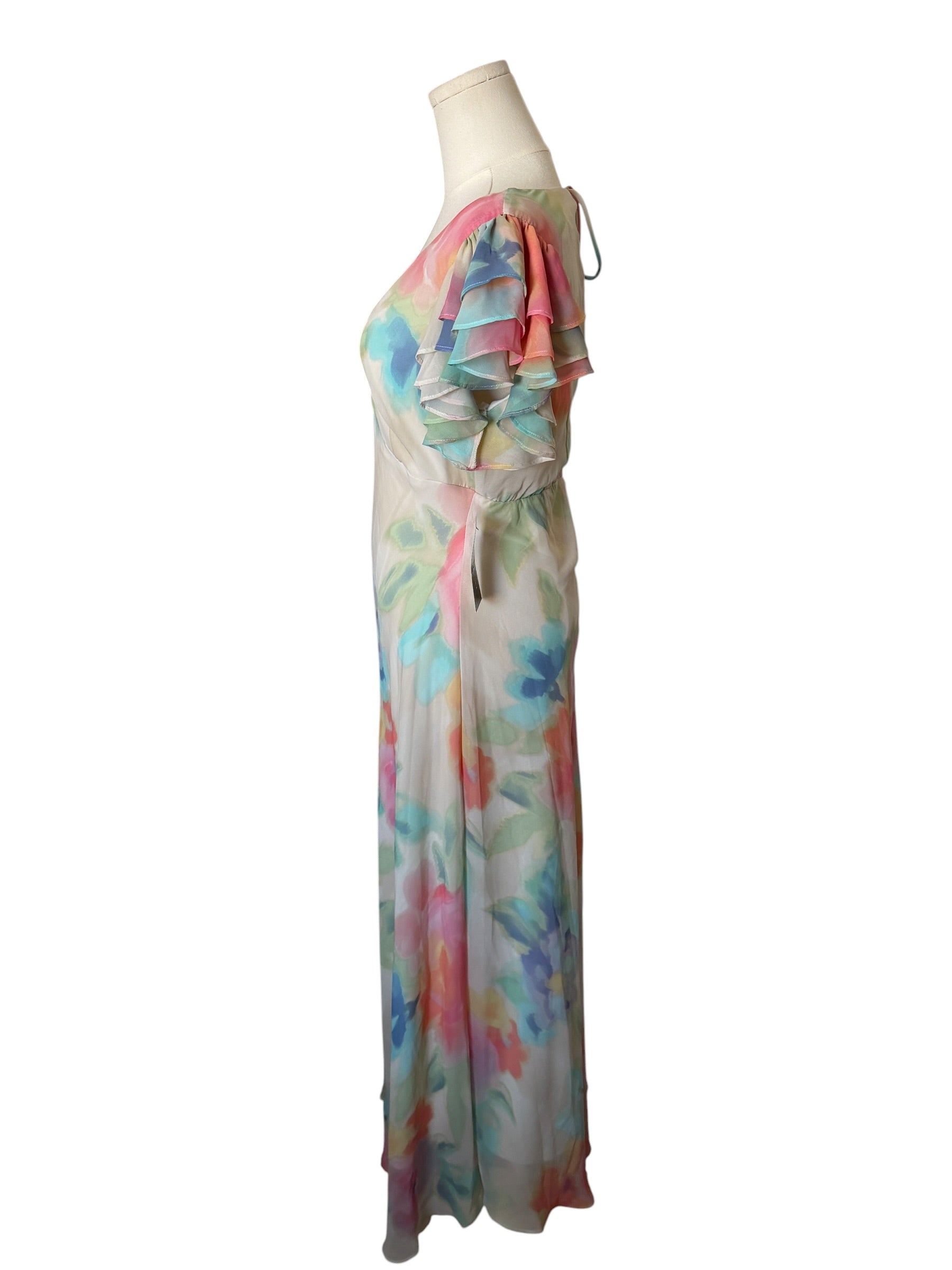Colorful dress on a mannequin against a white background