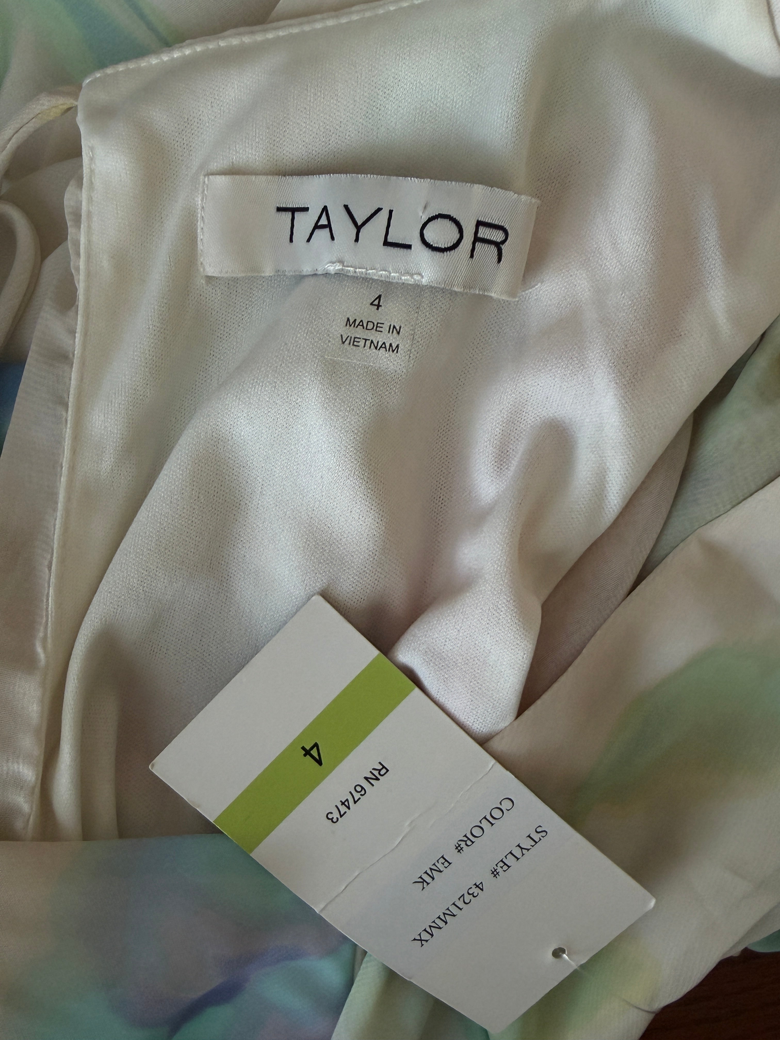 Close-up of a white shirt with 'Taylor' label and size tag on a blurred background