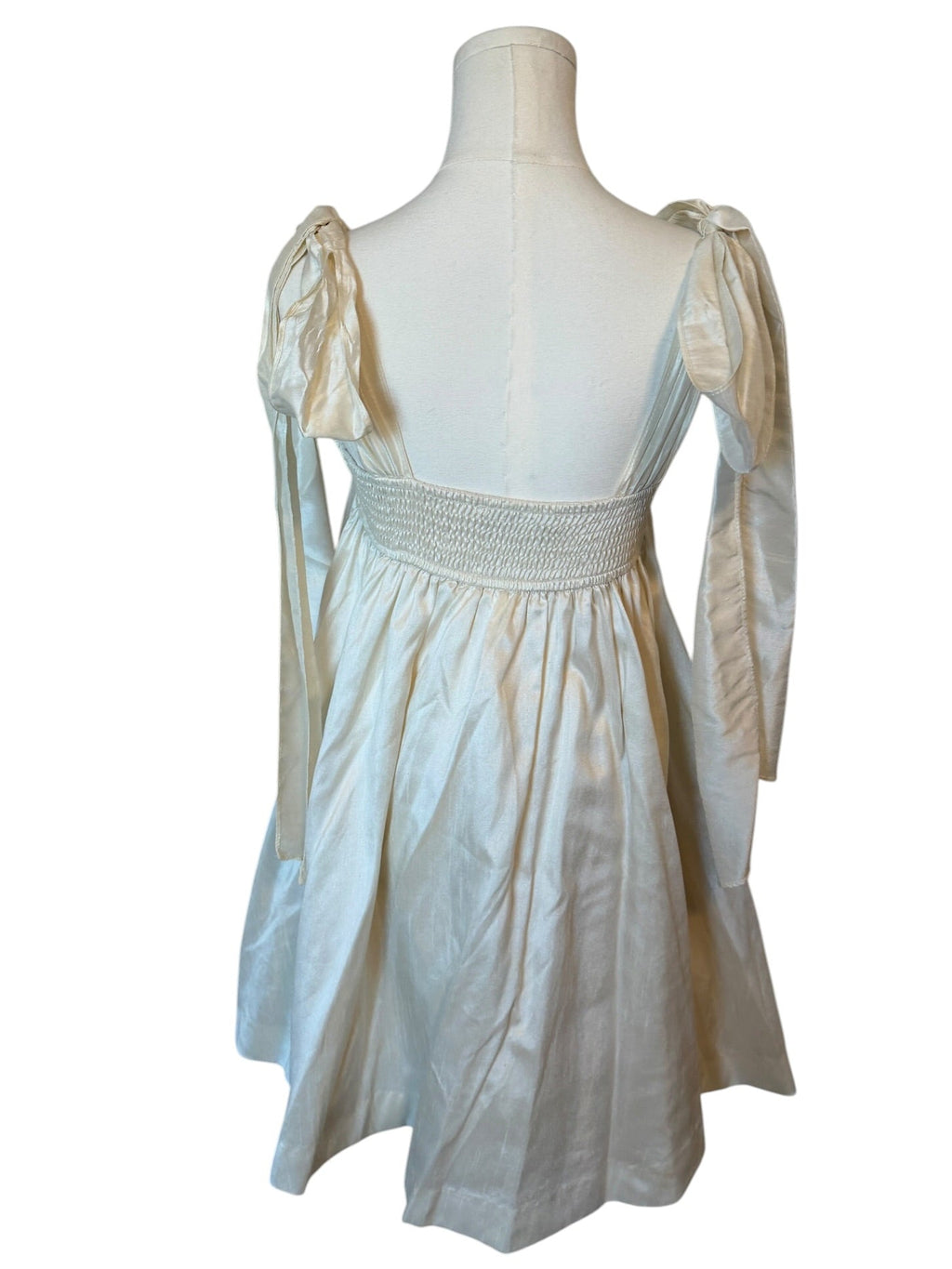 White dress on a mannequin against a white background