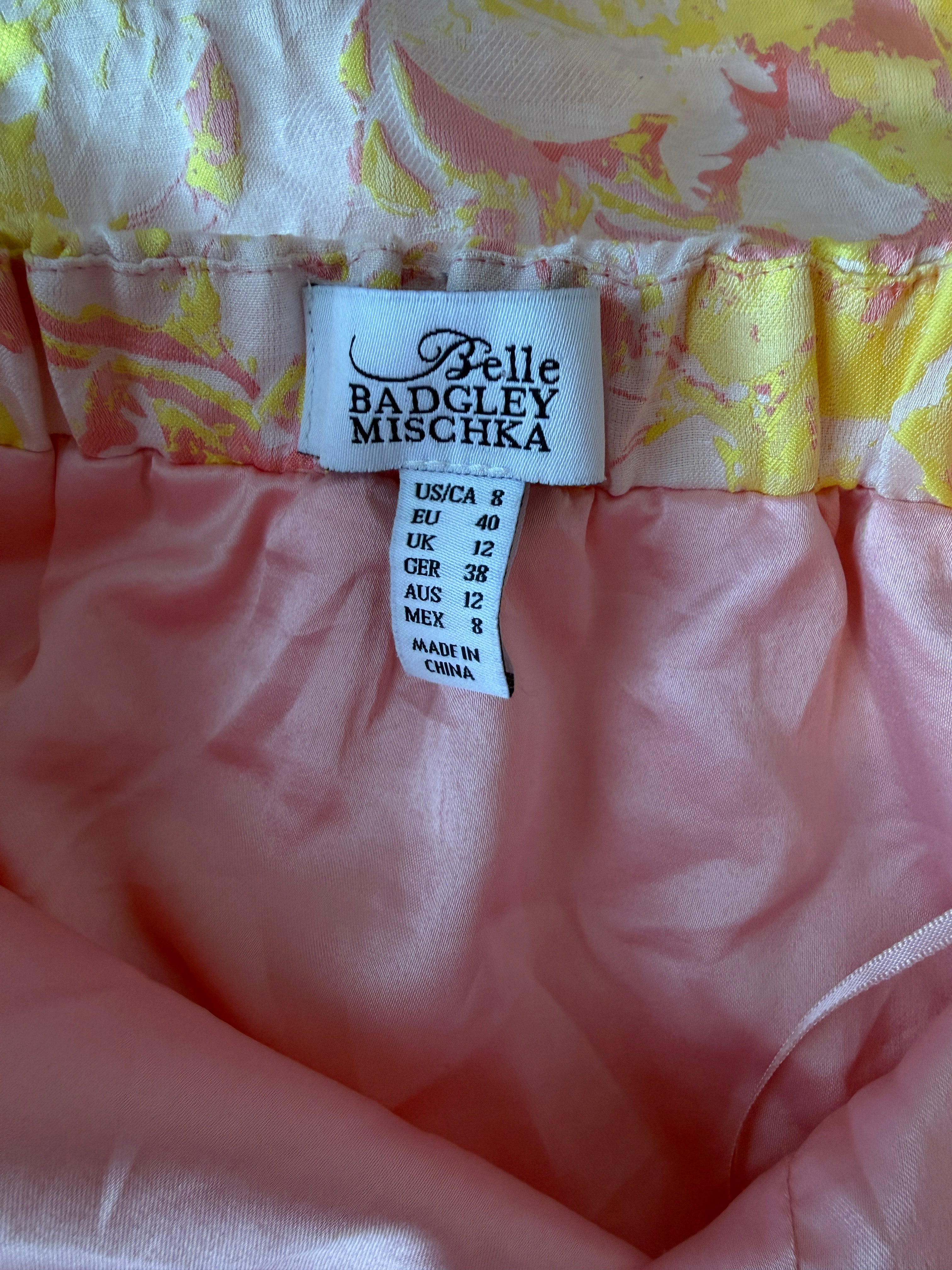 Close-up of a clothing tag on a garment with floral patterns.