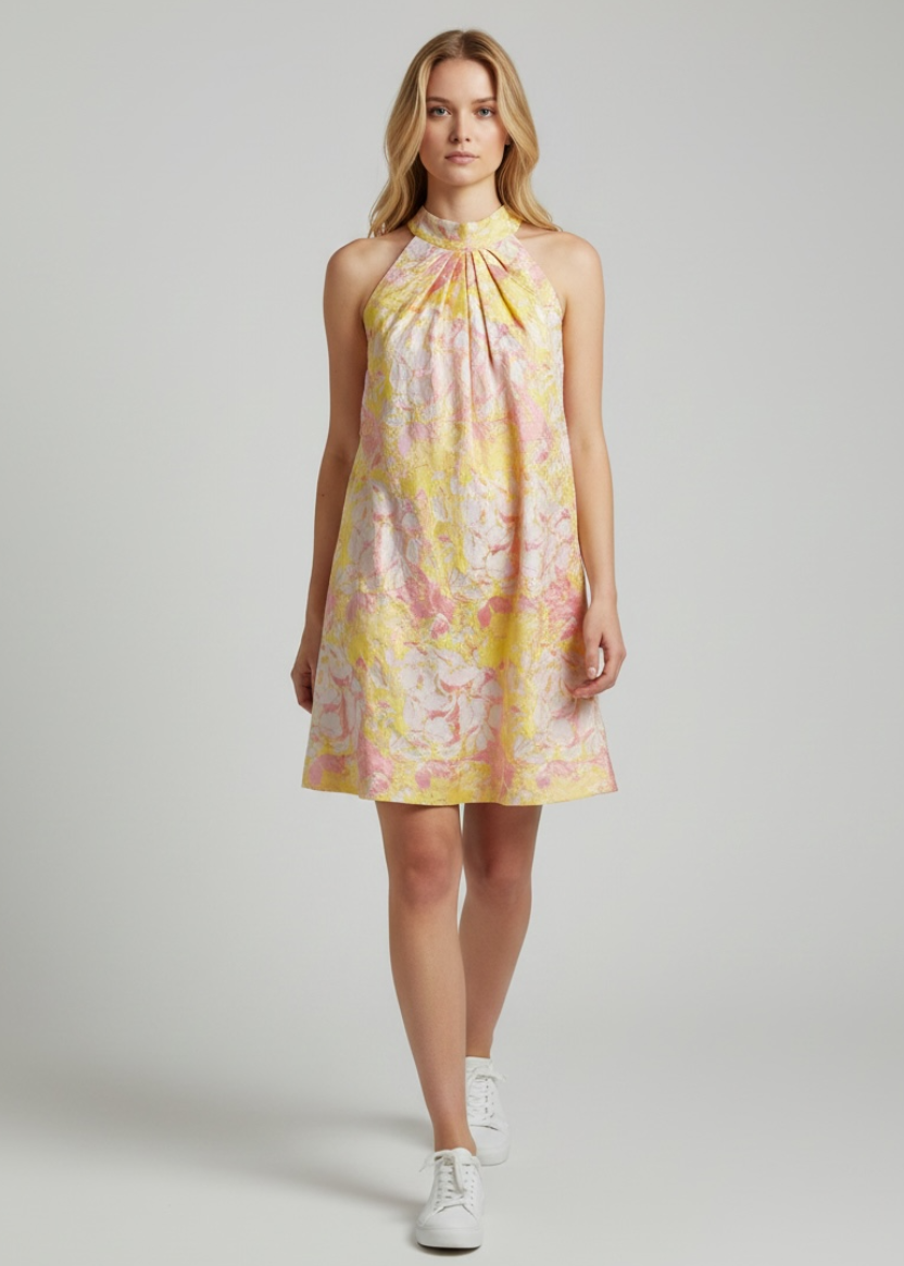 Woman wearing a floral dress on a plain background