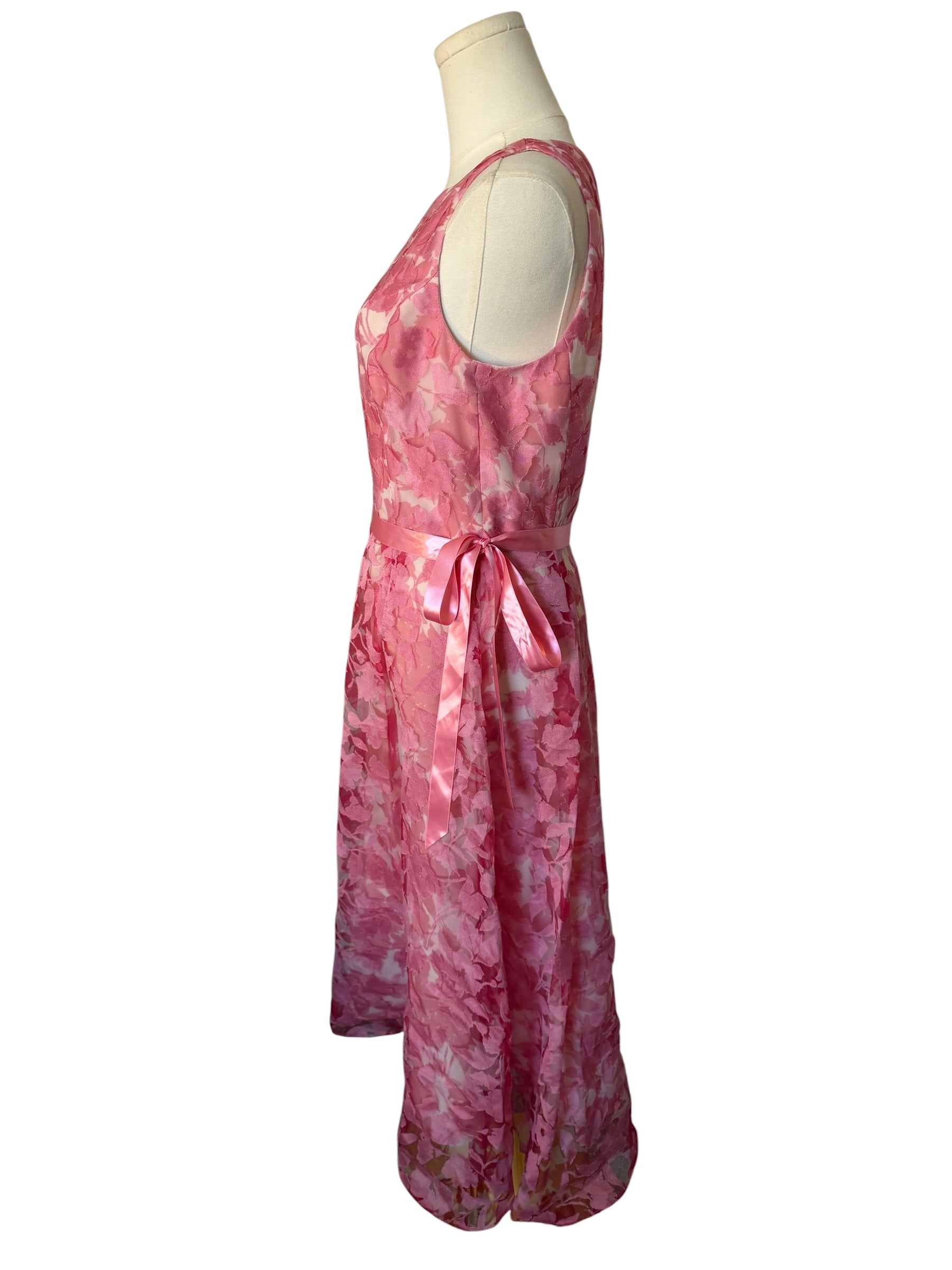 Pink tie-dye dress on a mannequin against a white background