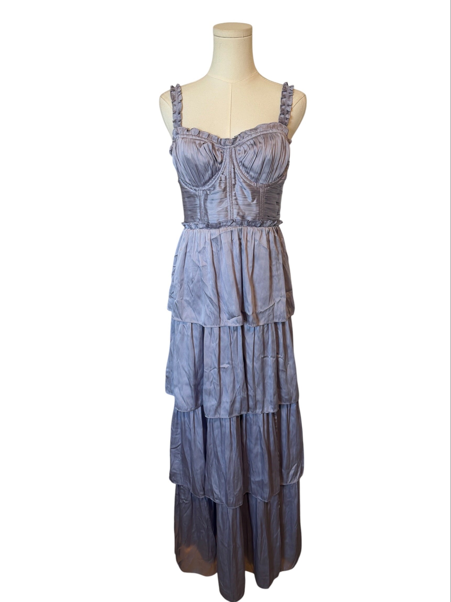 Blue tiered dress on a mannequin against a white background