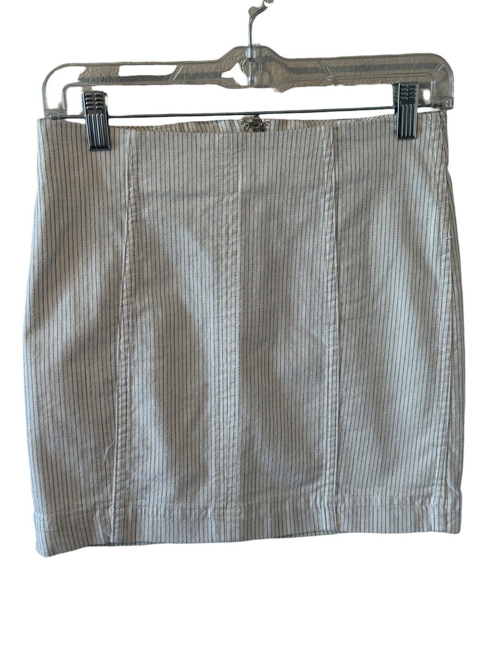 Striped skirt on a hanger against a white background