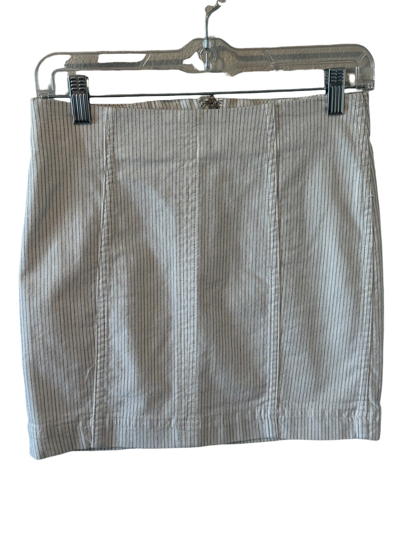 Striped skirt on a hanger against a white background