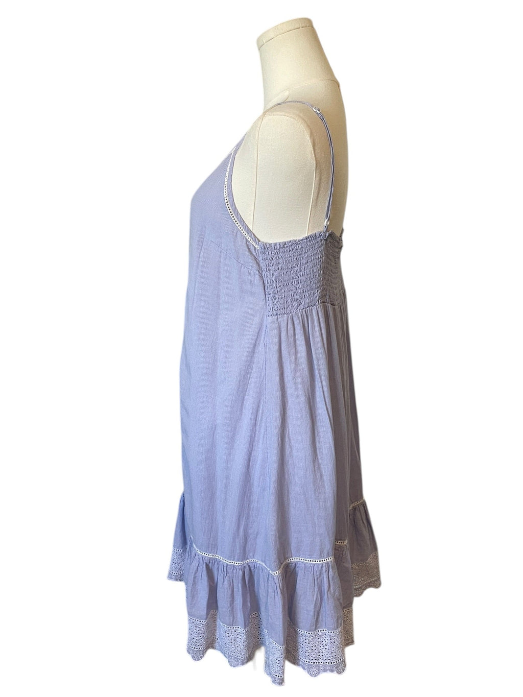 Light blue dress on a mannequin against a white background
